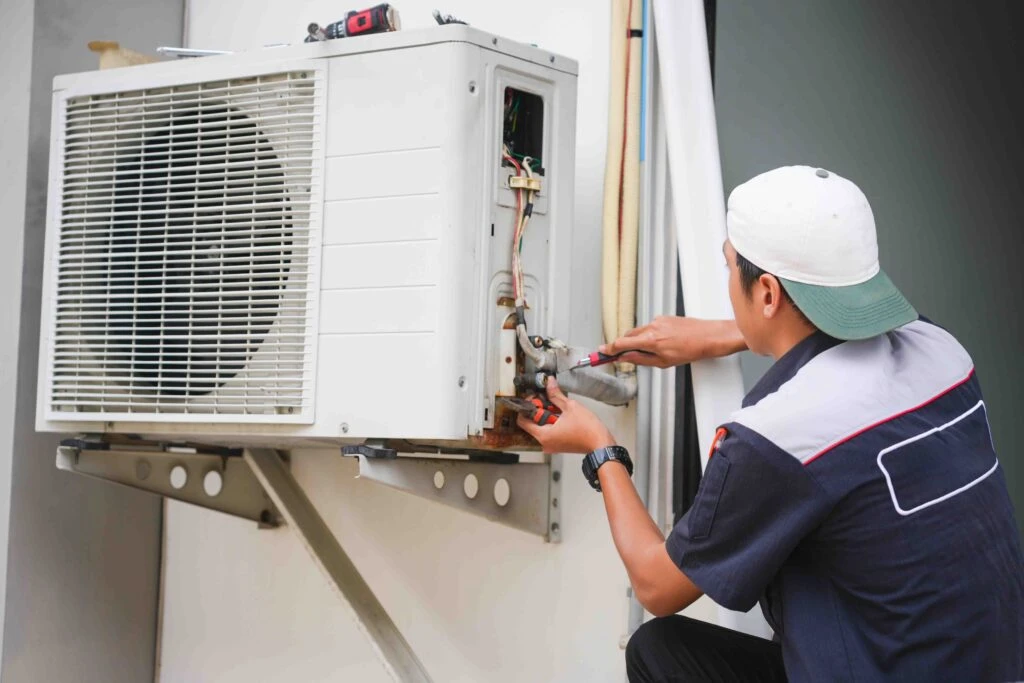 Homeowner performing DIY furnace maintenance